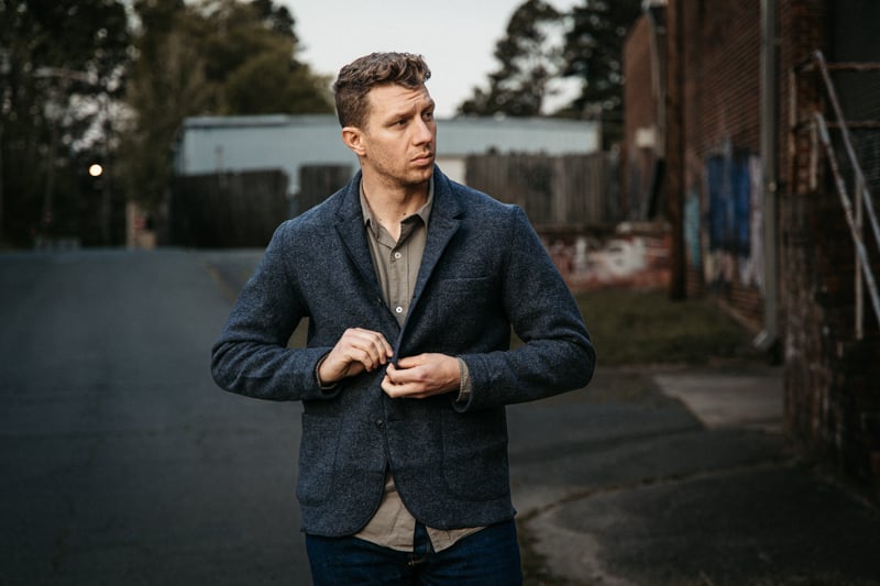 author walking in Buck Mason chore coat