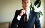 Blue Suit Combinations What to Wear with a Blue Suit Model Wearing Blue Suit and Burgundy Tie