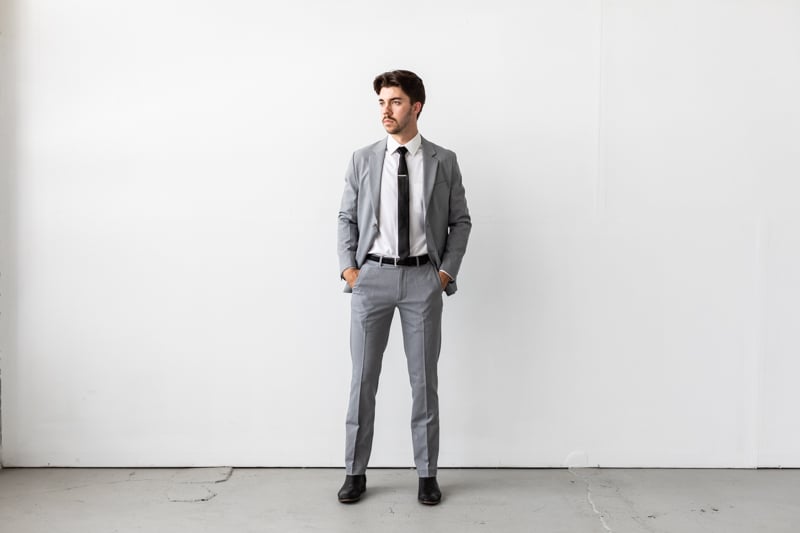 Bluffworks Presidio Blazer and Pants with jacket unbuttoned and hands in pockets