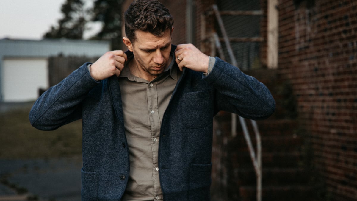 Buck Mason Review Model Wearing Chore Coat and Draped Twill One Pocket Shirt