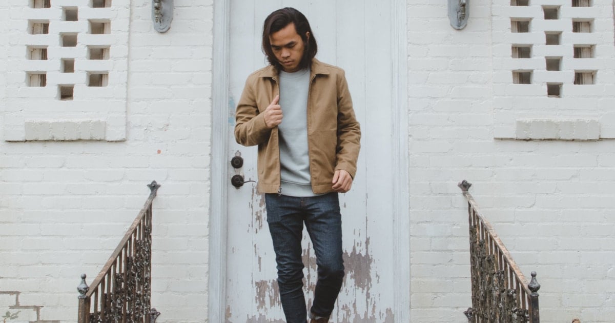 Everlane Review Model leaving house and wearing Everlane Fleece Crew Skinny Fit Jean with Midweight Canvas Jacket