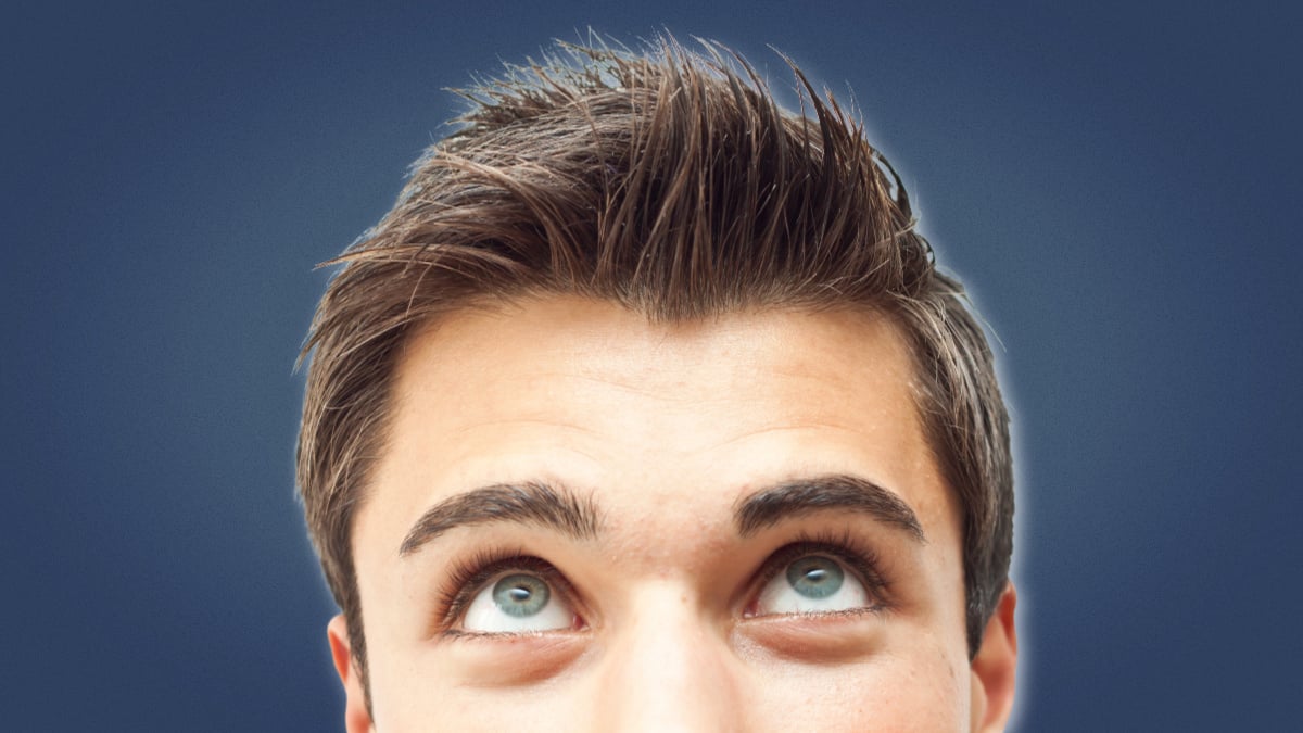 How to properly wash your hair man looking up at his hair