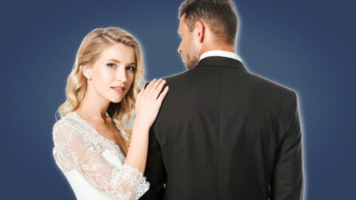 2021/08/Hypergamy-Attractive-Bride-in-White-Dress-Holding-Shoulder-of-Groom.jpg