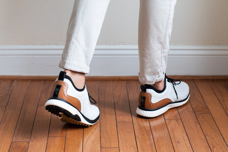 Johnston and Murphy XC4 H1 Luxe Hybrid golf shoes heel detail while being worn