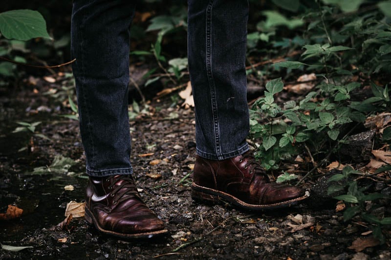 Model in woods wearing Thursday Captain