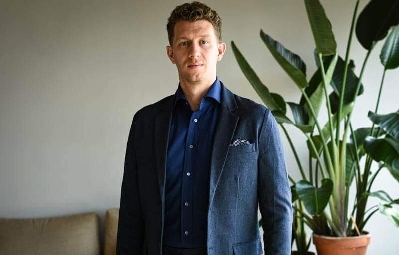 31 Ways to Become a Better Man Starting Today 4 model wearing navy suit and dark blue shirt