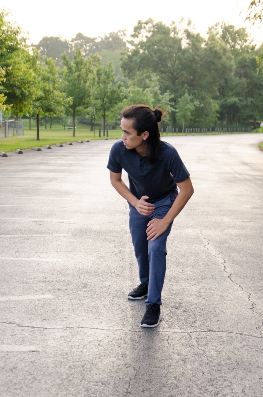 Model Wearing Public Rec Apparel And Stretching For A Run