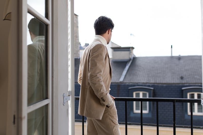Suitsupply Custom Suit model on balcony from over shoulder