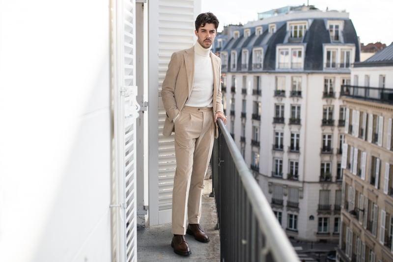 Suitsupply Custom Suit model on balcony looking out